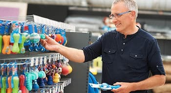 man shopping for dog toys