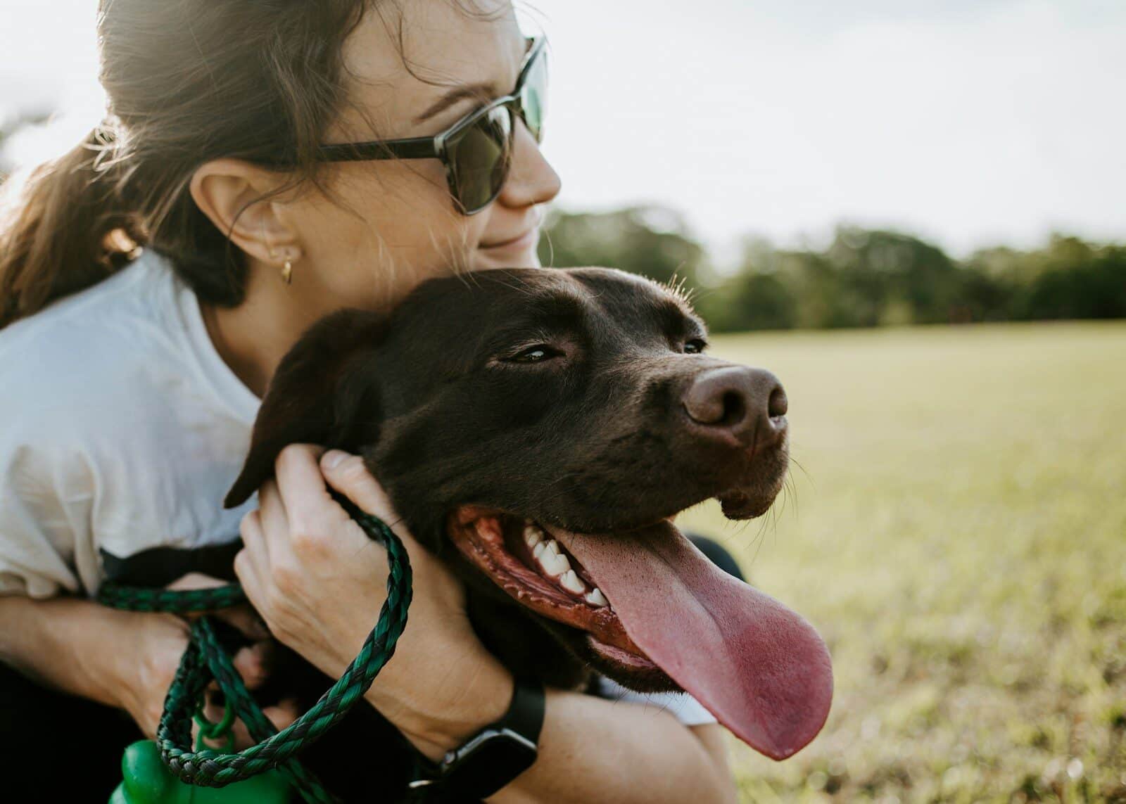 woman hugging a dog